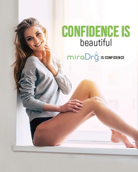Confident woman promoting miraDry treatment for beauty.