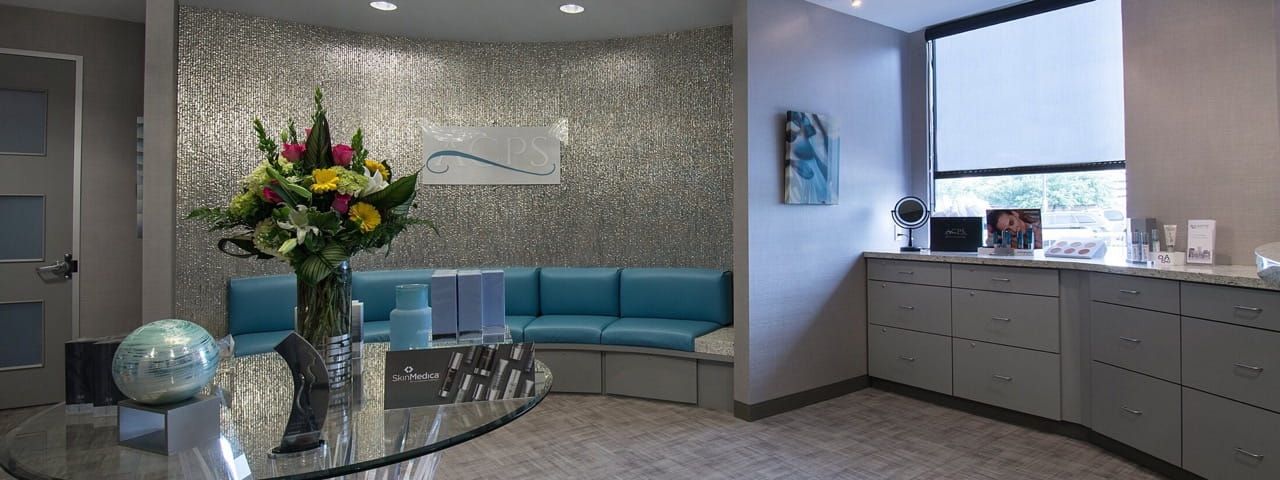 Modern reception area with floral arrangements.