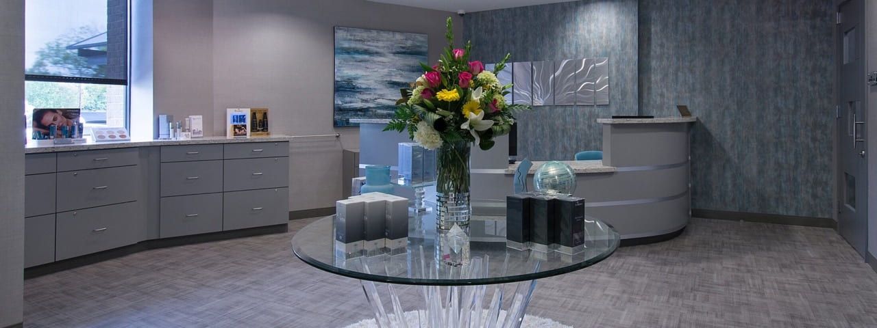 Modern reception area with floral centerpiece.