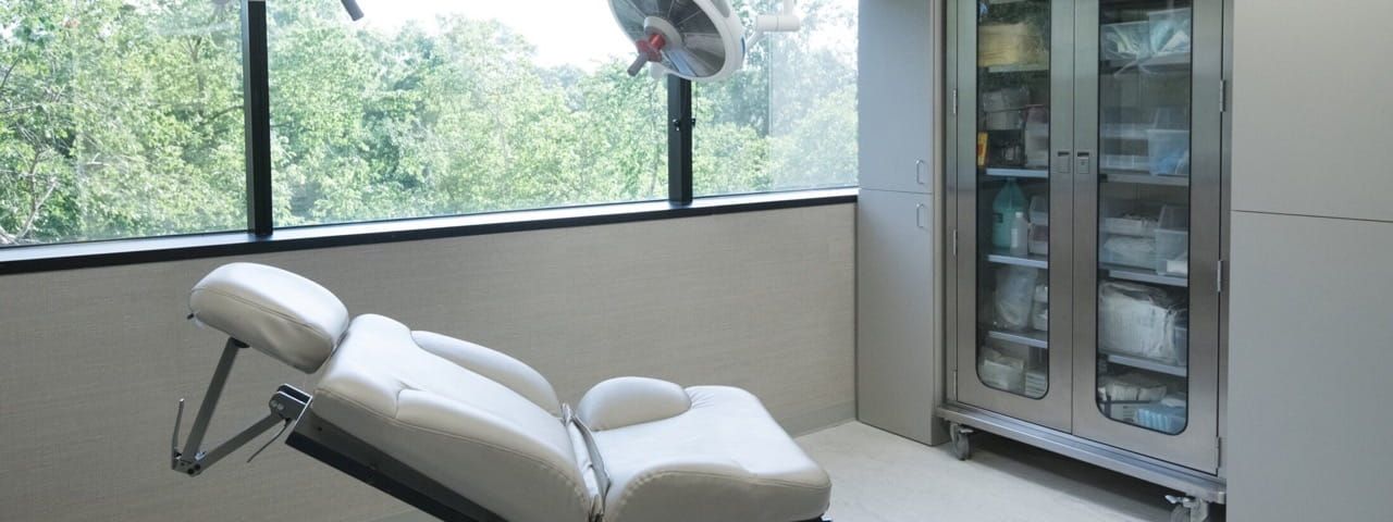 Modern medical room with an examination chair.
