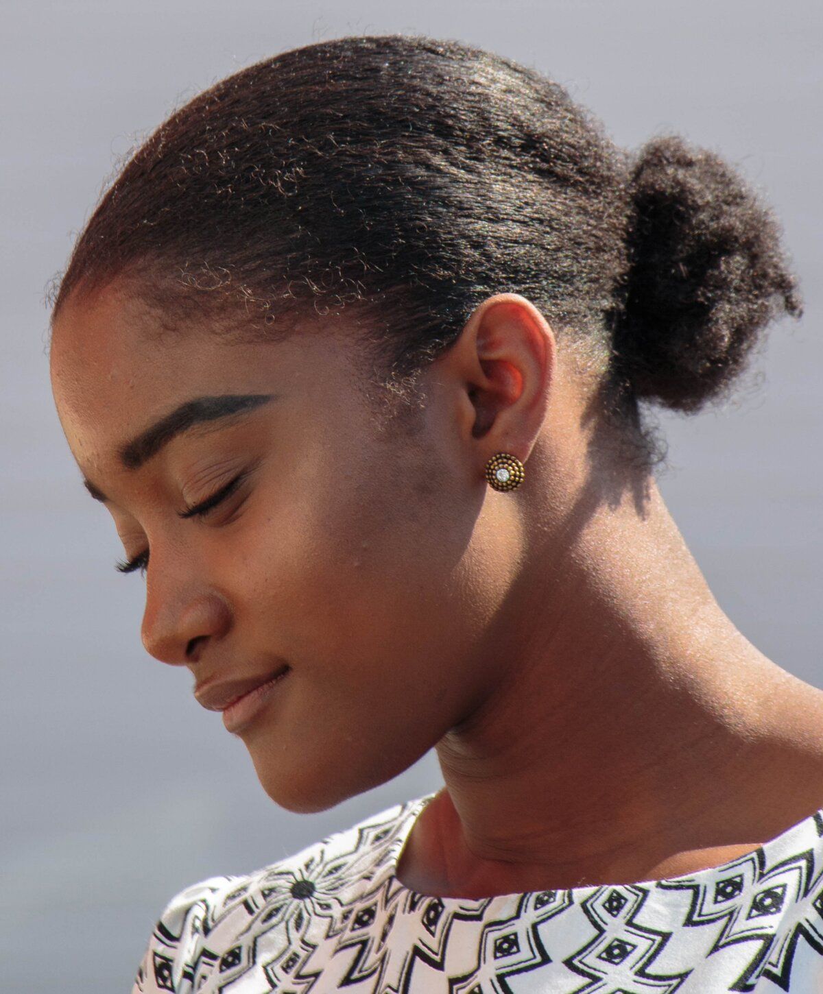 Profile of a woman with elegant hairstyle.