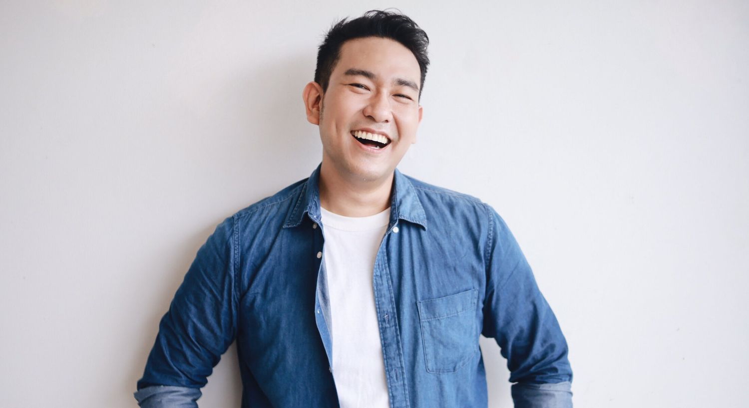 NeoGraft model in denim shirt against white background.